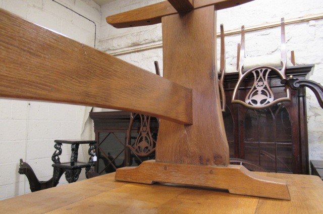 A COLIN ALMACK ADZED OAK DINING SUITE comprising multi panelled sideboard Image