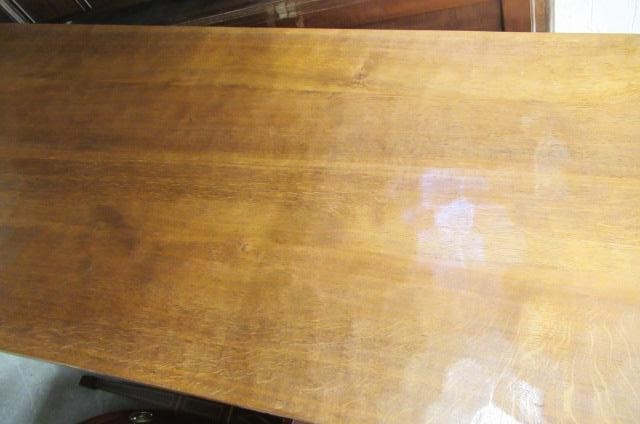 A COLIN ALMACK ADZED OAK DINING SUITE comprising multi panelled sideboard Image