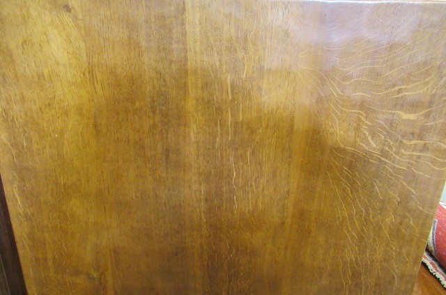 A COLIN ALMACK ADZED OAK DINING SUITE comprising multi panelled sideboard Image