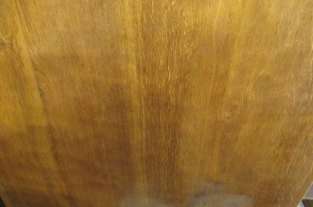 A COLIN ALMACK ADZED OAK DINING SUITE comprising multi panelled sideboard Image