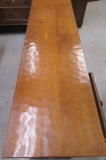 A COLIN ALMACK ADZED OAK DINING SUITE comprising multi panelled sideboard Image