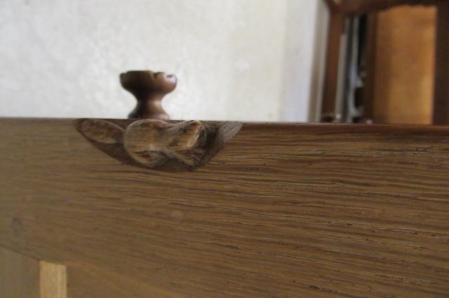 A COLIN ALMACK ADZED OAK DINING SUITE comprising multi panelled sideboard Image