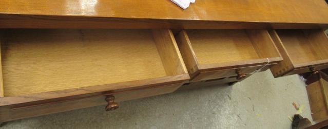 A COLIN ALMACK ADZED OAK DINING SUITE comprising multi panelled sideboard Image