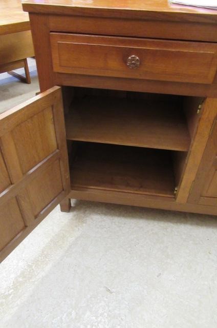 A COLIN ALMACK ADZED OAK DINING SUITE comprising multi panelled sideboard Image