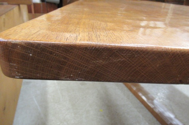 A COLIN ALMACK ADZED OAK DINING SUITE comprising multi panelled sideboard Image