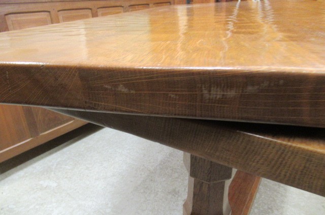 A COLIN ALMACK ADZED OAK DINING SUITE comprising multi panelled sideboard Image