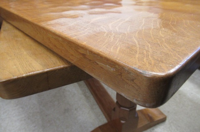 A COLIN ALMACK ADZED OAK DINING SUITE comprising multi panelled sideboard Image