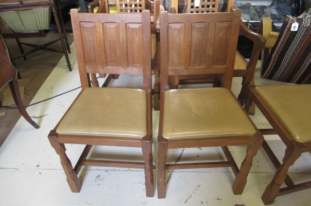 A COLIN ALMACK ADZED OAK DINING SUITE comprising multi panelled sideboard Image