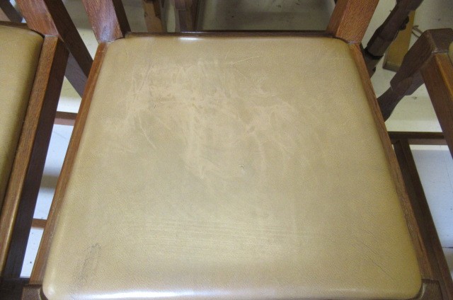 A COLIN ALMACK ADZED OAK DINING SUITE comprising multi panelled sideboard Image