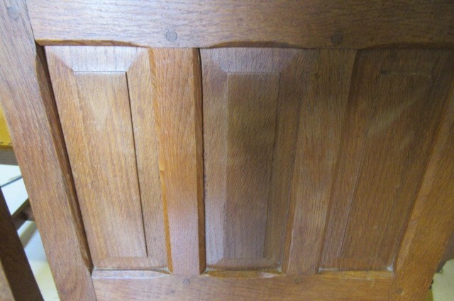 A COLIN ALMACK ADZED OAK DINING SUITE comprising multi panelled sideboard Image