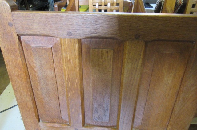 A COLIN ALMACK ADZED OAK DINING SUITE comprising multi panelled sideboard Image
