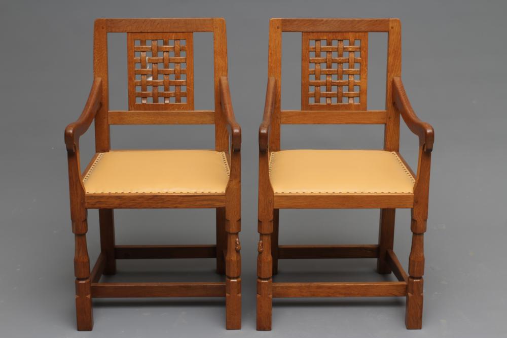 A PAIR OF ROBERT THOMPSON ADZED OAK ELBOW CHAIRS Image