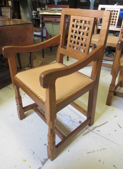 A PAIR OF ROBERT THOMPSON ADZED OAK ELBOW CHAIRS Image