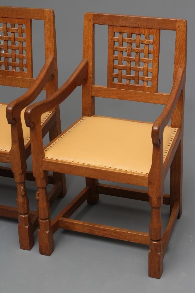 A PAIR OF ROBERT THOMPSON ADZED OAK ELBOW CHAIRS Image