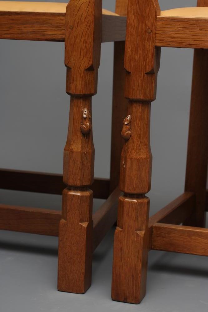 A PAIR OF ROBERT THOMPSON ADZED OAK ELBOW CHAIRS Image