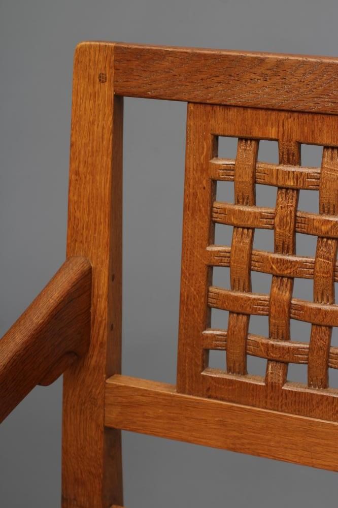 A PAIR OF ROBERT THOMPSON ADZED OAK ELBOW CHAIRS Image