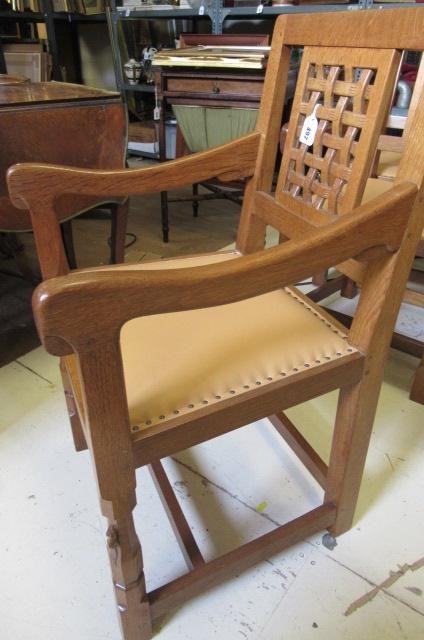 A PAIR OF ROBERT THOMPSON ADZED OAK ELBOW CHAIRS Image