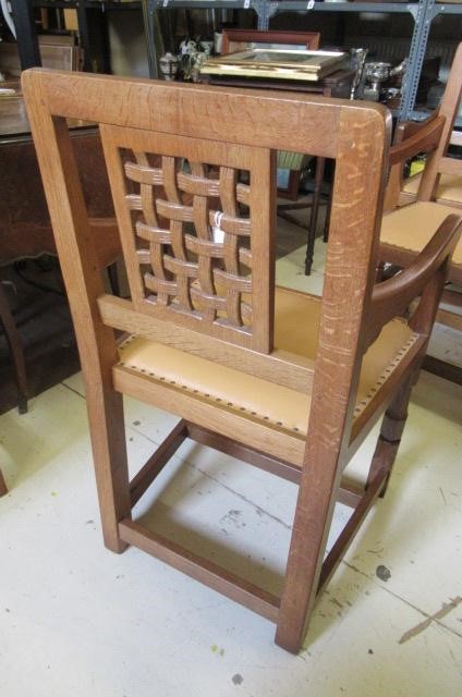 A PAIR OF ROBERT THOMPSON ADZED OAK ELBOW CHAIRS Image