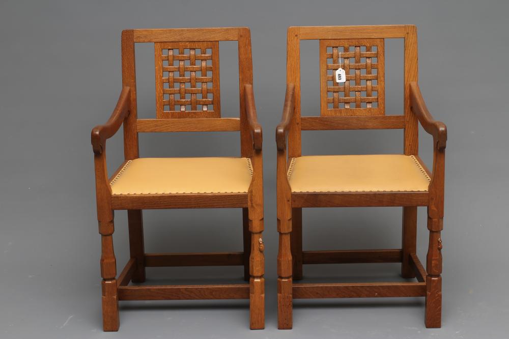 A PAIR OF ROBERT THOMPSON ADZED OAK ELBOW CHAIRS Image