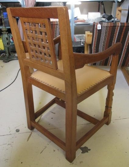 A PAIR OF ROBERT THOMPSON ADZED OAK ELBOW CHAIRS Image