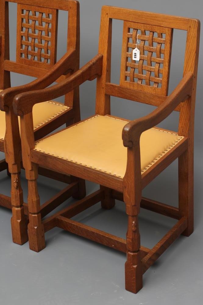 A PAIR OF ROBERT THOMPSON ADZED OAK ELBOW CHAIRS Image