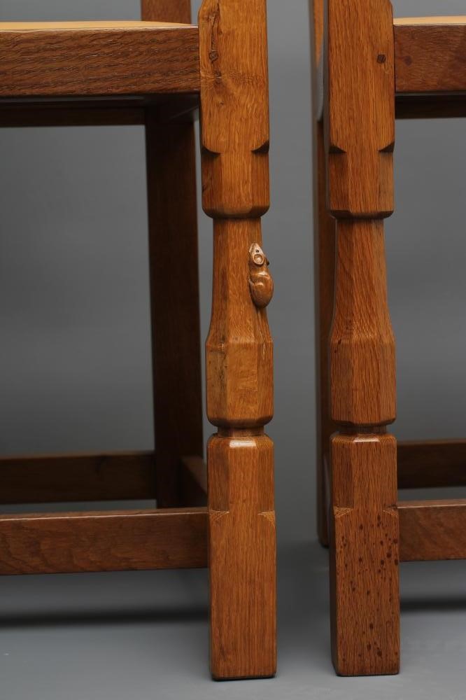A PAIR OF ROBERT THOMPSON ADZED OAK ELBOW CHAIRS Image