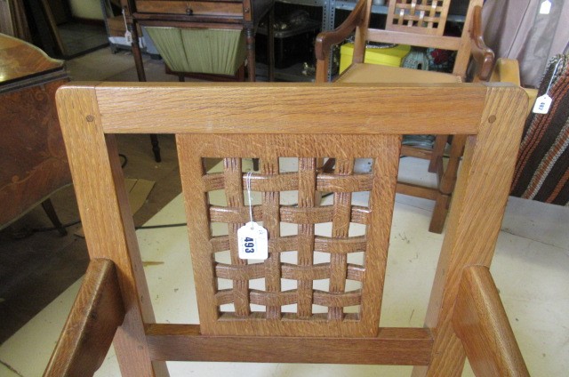 A PAIR OF ROBERT THOMPSON ADZED OAK ELBOW CHAIRS Image