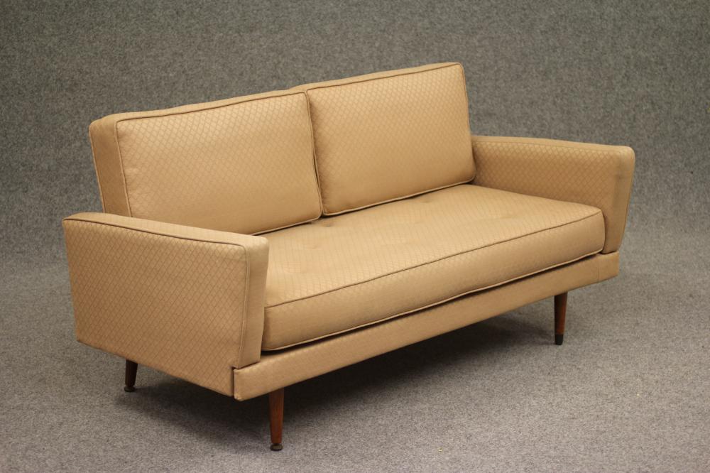 A TEAK AND IRON FRAMED SOFA BED Image