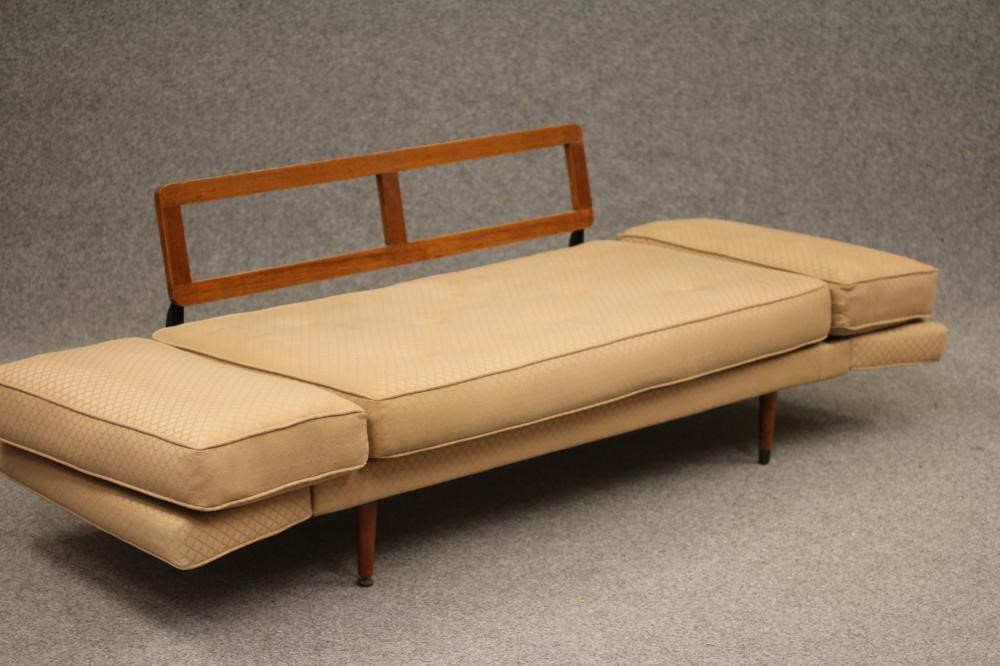 A TEAK AND IRON FRAMED SOFA BED Image