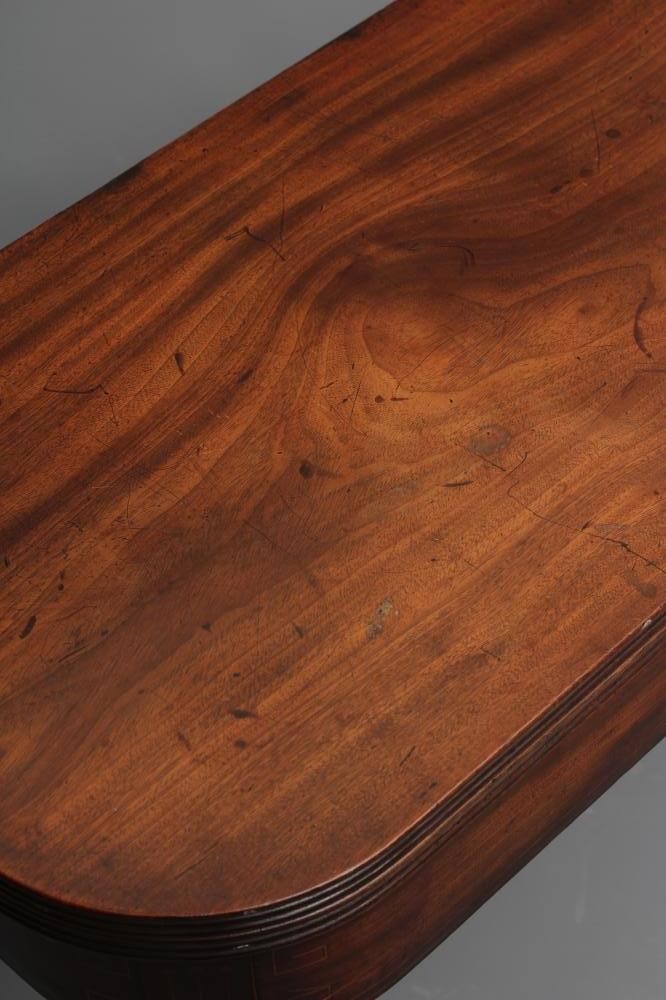 A REGENCY MAHOGANY FOLDING TEA TABLE of rounded oblong form with reeded edged top Image