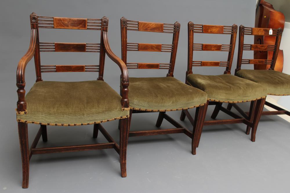 A SET OF SEVEN REGENCY MAHOGANY DINING CHAIRS including an elbow chair Image