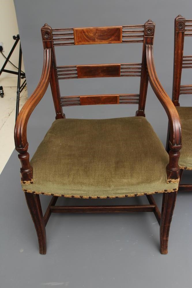 A SET OF SEVEN REGENCY MAHOGANY DINING CHAIRS including an elbow chair Image