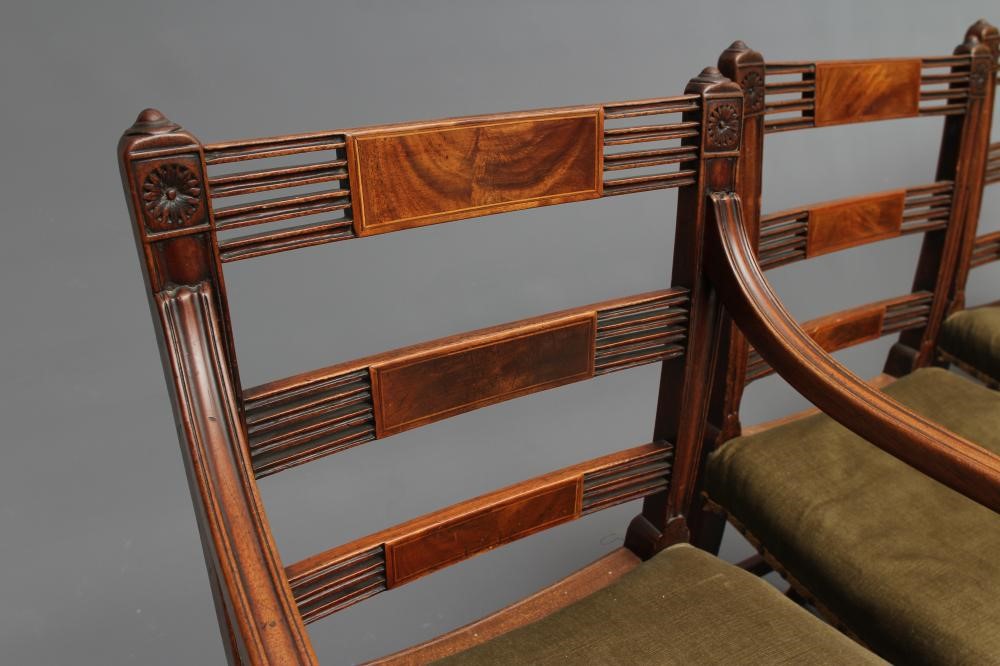 A SET OF SEVEN REGENCY MAHOGANY DINING CHAIRS including an elbow chair Image
