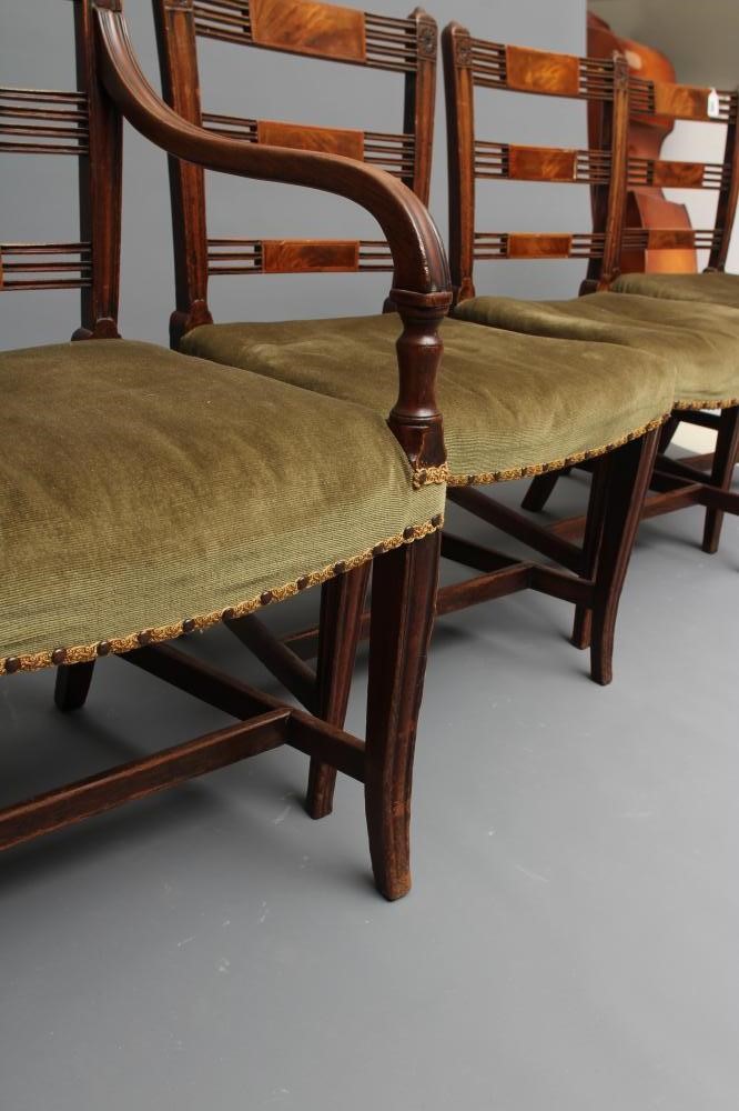 A SET OF SEVEN REGENCY MAHOGANY DINING CHAIRS including an elbow chair Image