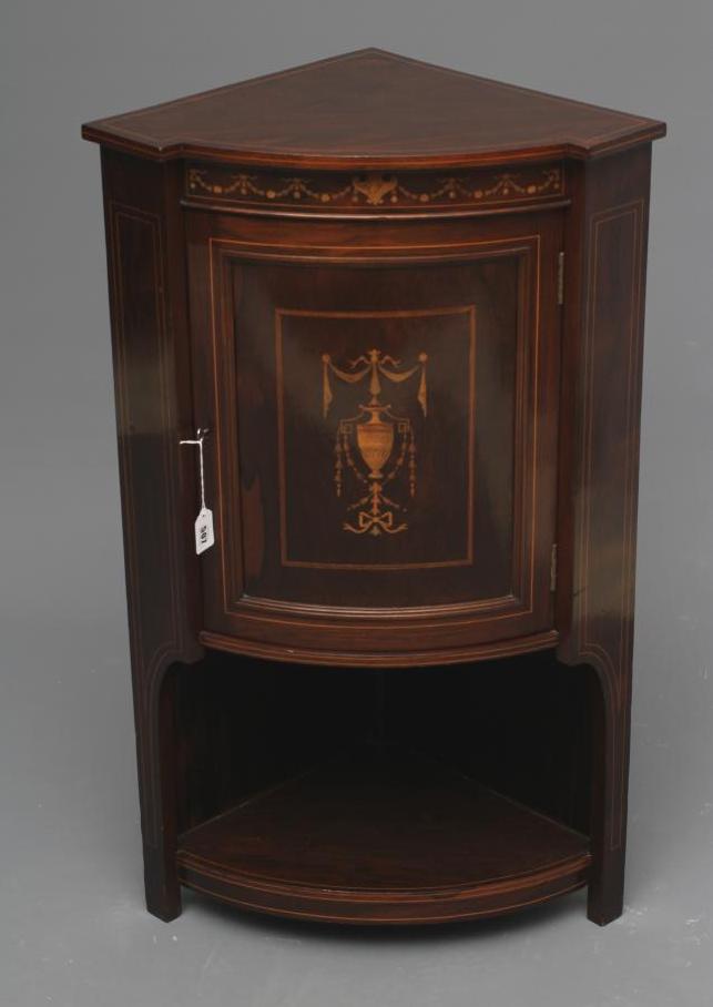 A LATE VICTORIAN ROSEWOOD AND MARQUETRY STANDING CORNER CUPBOARD of low bowed form with stringing Image