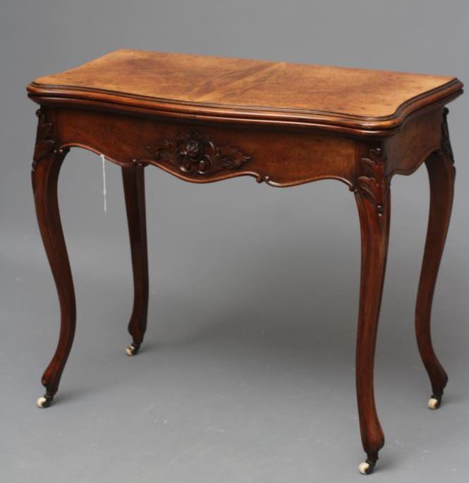 A VICTORIAN FOLDING CARD TABLE of serpentine form in the French taste Image