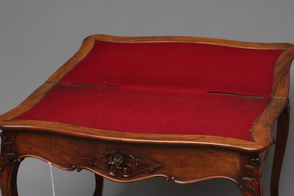 A VICTORIAN FOLDING CARD TABLE of serpentine form in the French taste Image