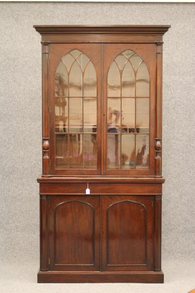 A LATE GEORGIAN GOTHIC MAHOGANY TWO STAGE BOOKCASE Image