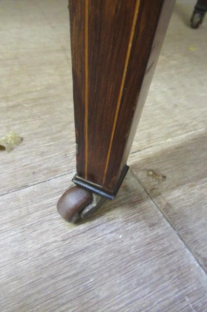 A LATE VICTORIAN SHERATON REVIVAL ROSEWOOD AND MARQUETRY WRITING TABLE Image