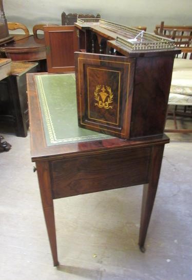 A LATE VICTORIAN SHERATON REVIVAL ROSEWOOD AND MARQUETRY WRITING TABLE Image