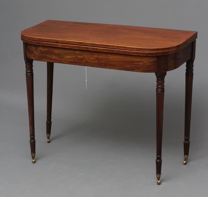 A GEORGIAN MAHOGANY FOLDING TEA TABLE Image