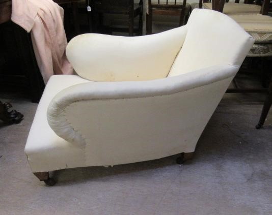 AN EDWARDIAN MAHOGANY ARMCHAIR in the manner of Howard Image