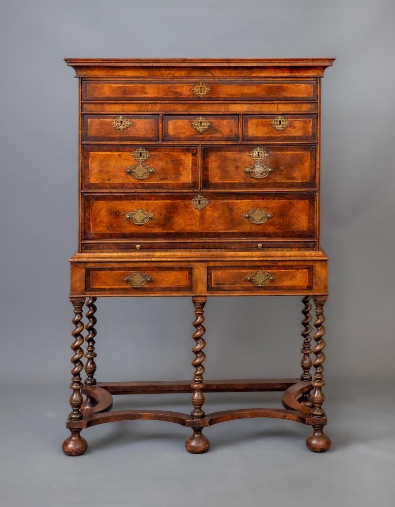 A WALNUT CHEST ON STAND Image