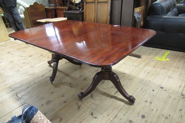 A WILLIAM IV MAHOGANY TWIN PEDESTAL DINING TABLE with a single leaf Image