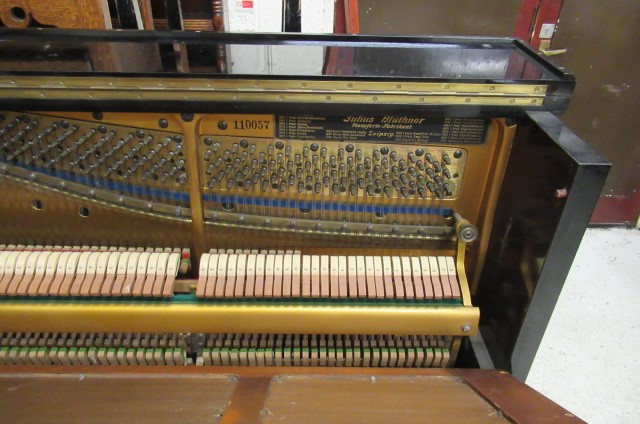 A BLUTHNER UPRIGHT PIANO. c.1925 Image