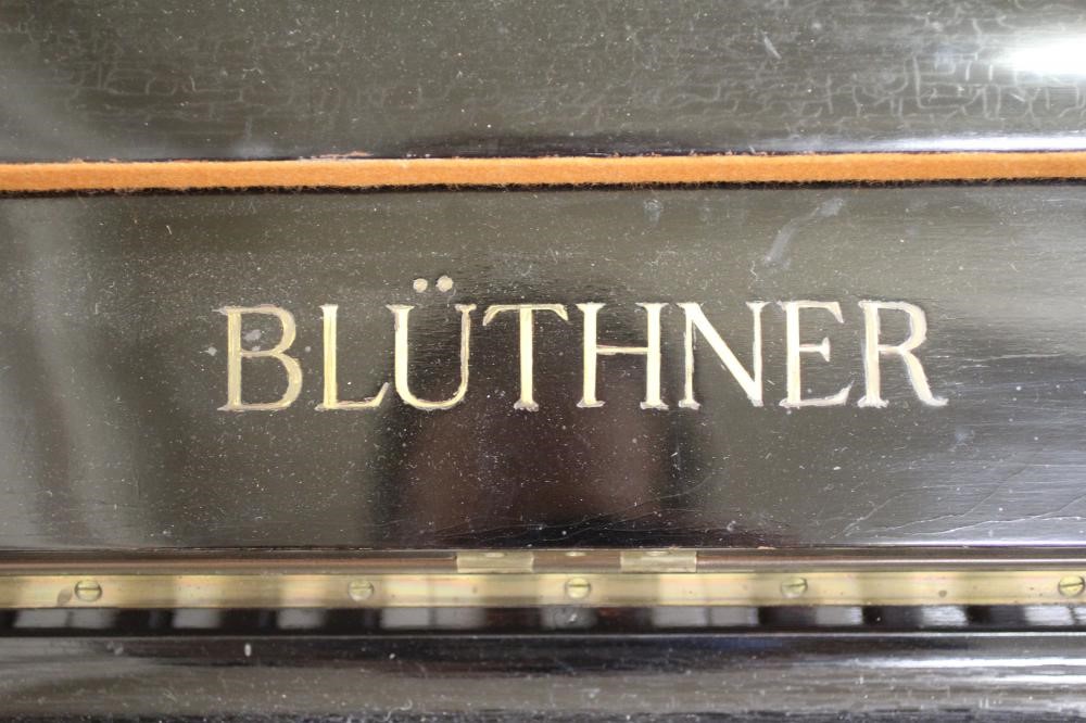 A BLUTHNER UPRIGHT PIANO. c.1925 Image