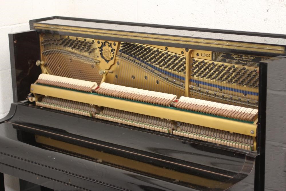 A BLUTHNER UPRIGHT PIANO. c.1925 Image