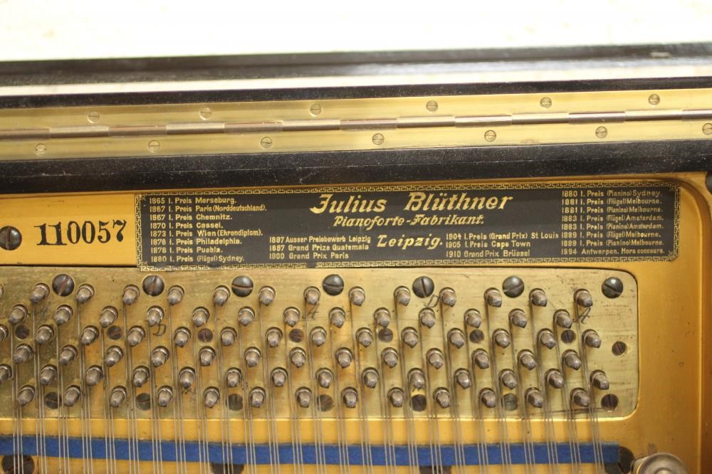 A BLUTHNER UPRIGHT PIANO. c.1925 Image