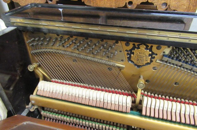 A BLUTHNER UPRIGHT PIANO. c.1925 Image