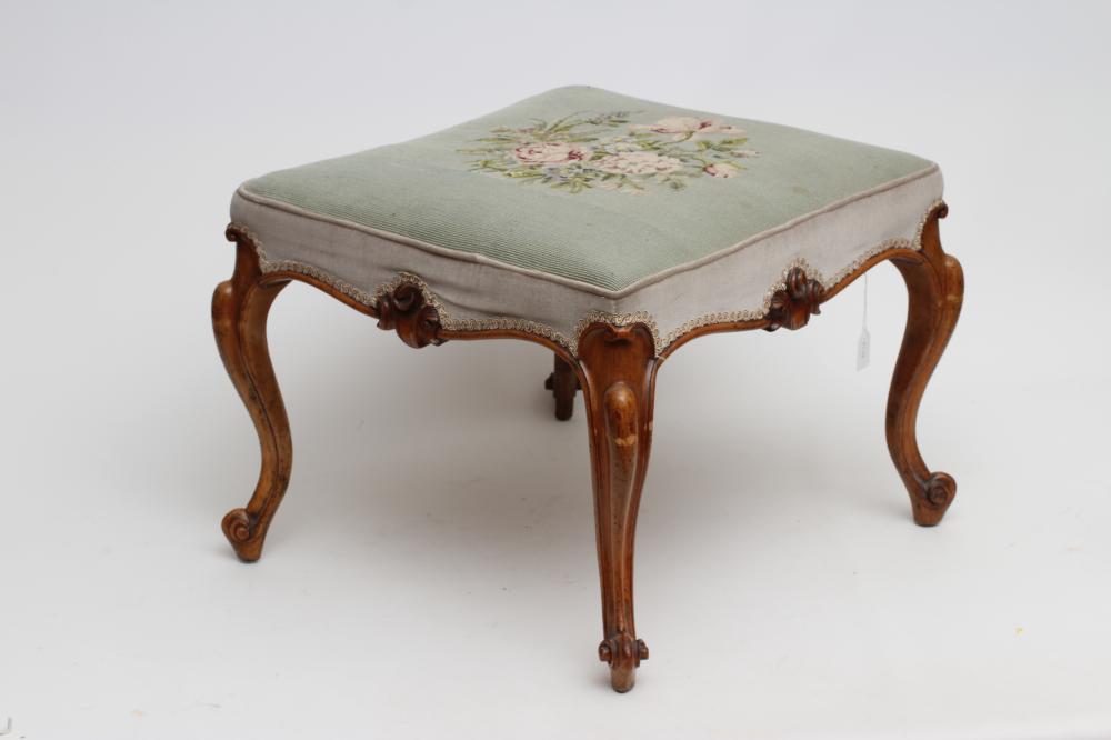 A VICTORIAN WALNUT DRESSING STOOL of long form with overstuffed seat in pale green floral gros point Image